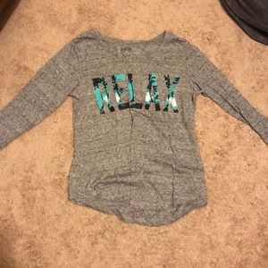 “relax” grey long sleeved shirt